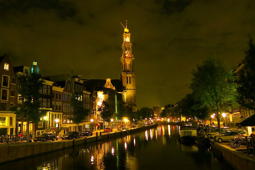 Amsterdam at night with Westerkerk at the far distance